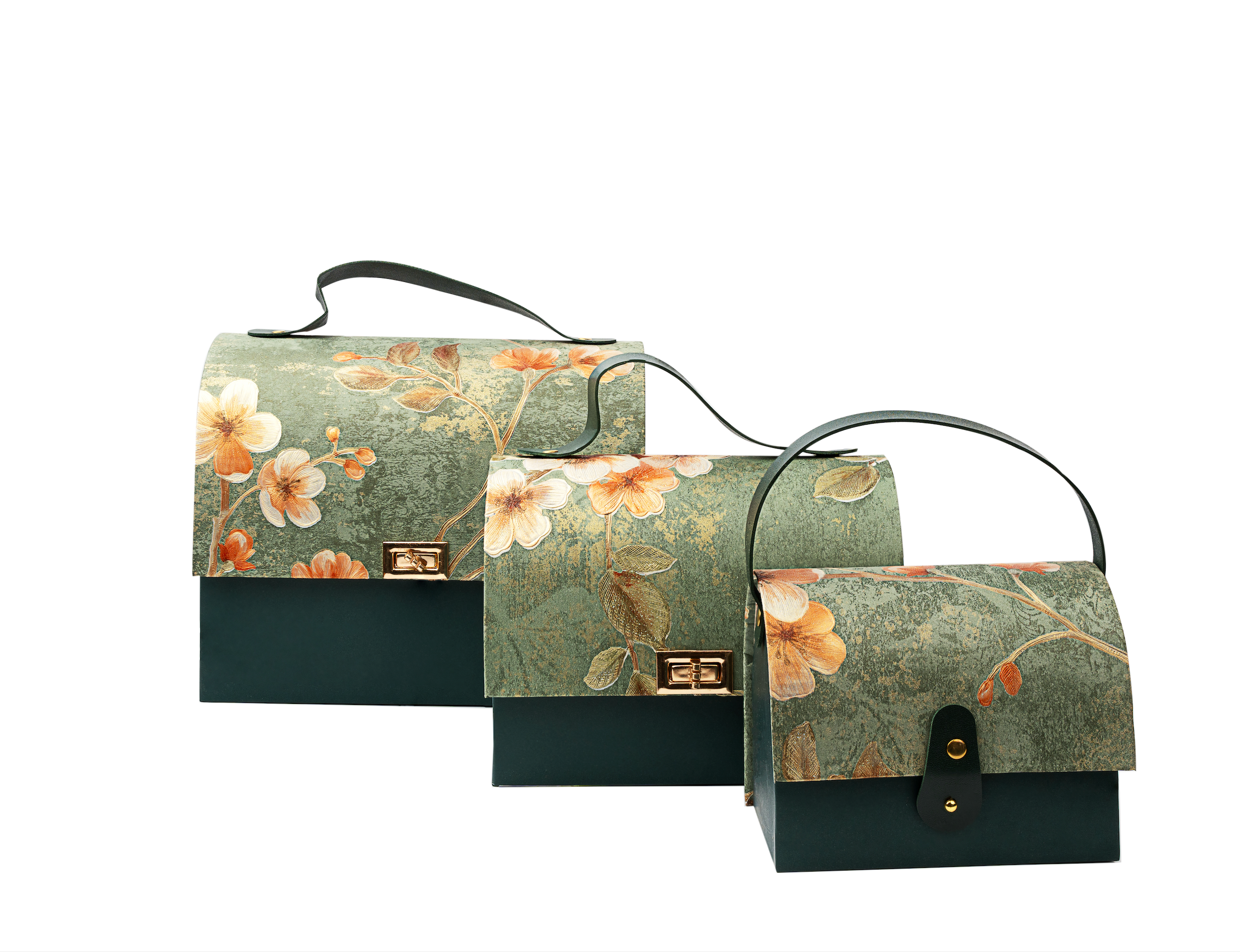 Set of three floral-patterned handbags with green and black accents on a white background